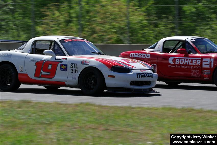 Nolan Elder's STL Mazda Miata passes Andrew Jenkins' Spec Miata Mazda Miata