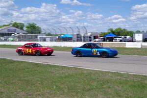 Rick Buan's Spec Miata Mazda Miata and Eric Chang's ITA Mazda Miata