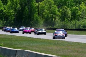 The small-bore field on the first lap of the race between turns 3 and 4.