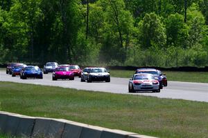 The small-bore field on the first lap of the race between turns 3 and 4.