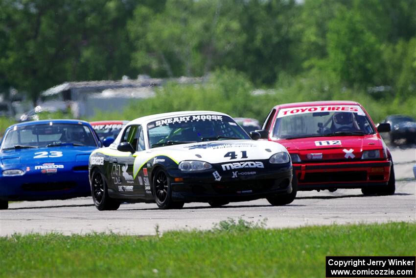 Samantha Silver's Spec Miata Mazda Miata passes Ken Sonderup's ITC Honda Civic