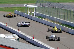 The Formula and Sports Racer group leaves pit lane on the pace lap.