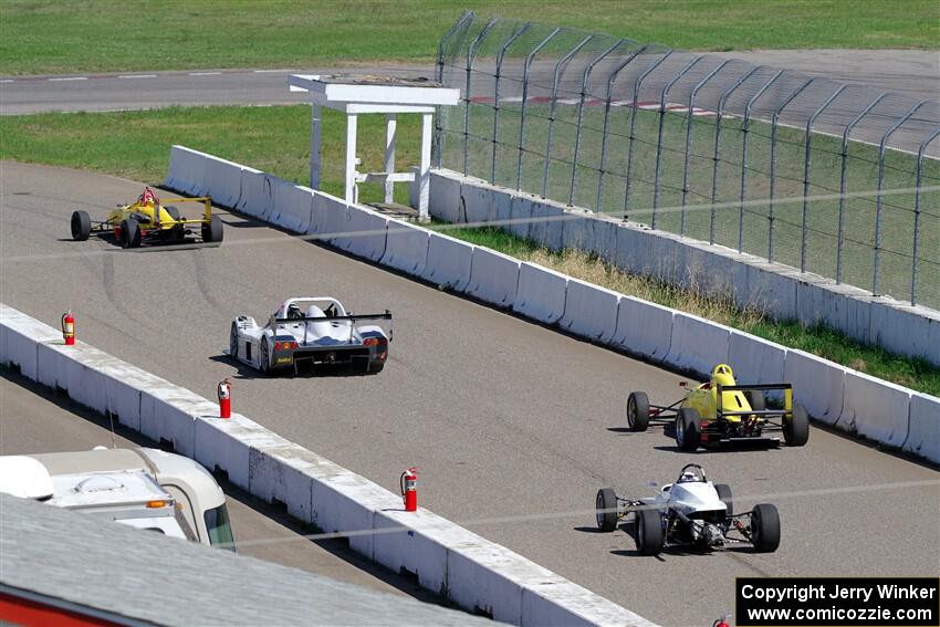 The Formula and Sports Racer group leaves pit lane on the pace lap.