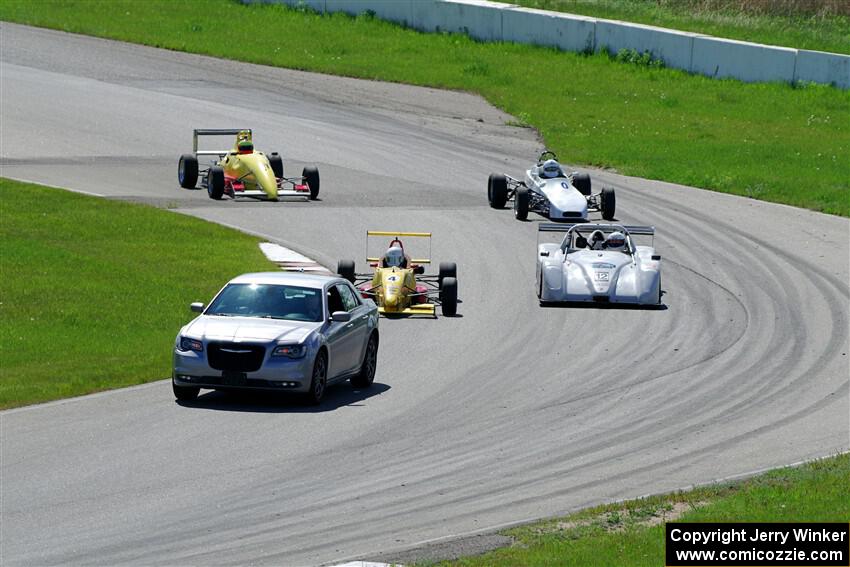 The Formula and Sports Racer group comes through turn 11 on the pace lap.