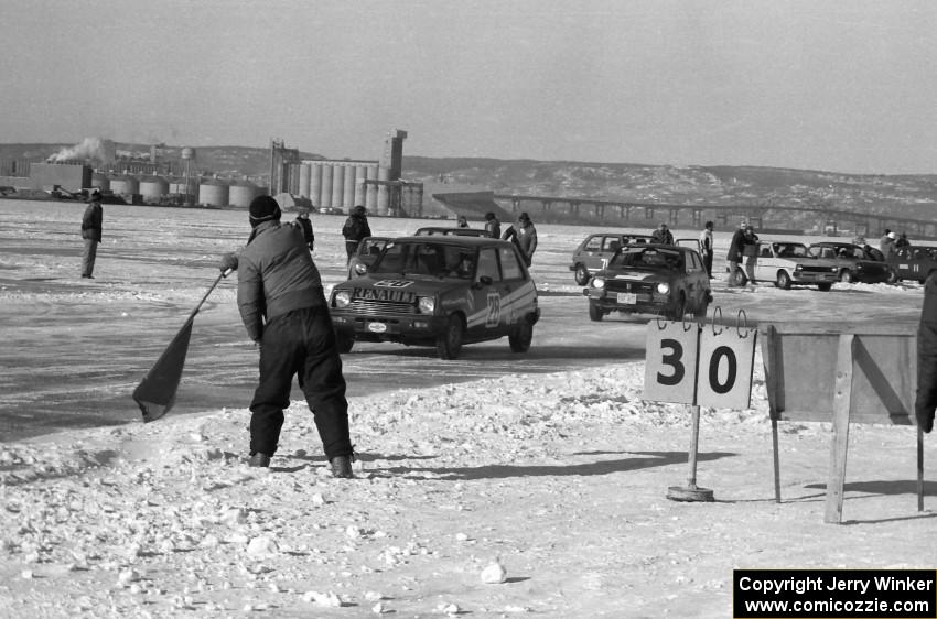 The green flag flies for a LeMans-style start of the very first Showroom Enduro race.