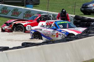 Robert Stout's and Ara Malkhassian's Mazda MX-5 Cups crash out at turn 7.