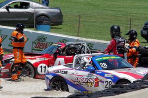 Robert Stout's and Ara Malkhassian's Mazda MX-5 Cups crash out at turn 7.