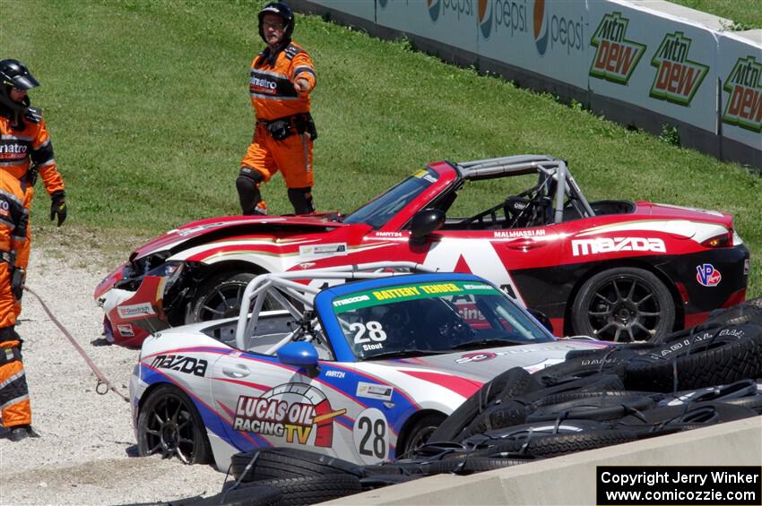 Robert Stout's and Ara Malkhassian's Mazda MX-5 Cups crash out at turn 7.
