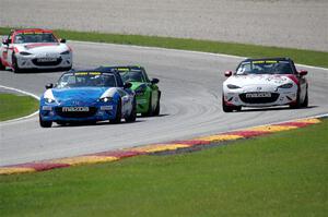 Keith Jensen's, Hernan Palermo's, Tom Martin, III's, Brian Henderson's and Nicholas Evancich's Mazda MX-5 Cups