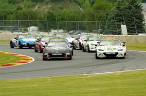 The Mazda MX-5 Cup field heads through turn 14 on the pace lap - John Dean, II and Nathanial Sparks front row.