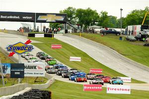 The Mazda MX-5 Cup field heads uphill to the green flag.