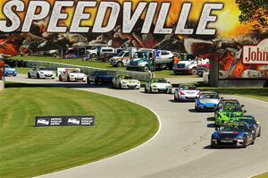 Mazda MX-5 Cup cars in the carousel on lap 2.