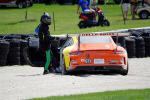 Tom Balames' Porsche GT3 Cup is stuck in the gravel trap at turn 14 on the final lap.