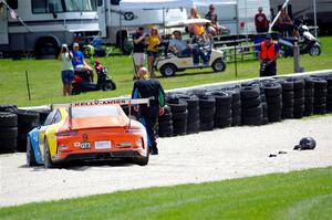 Tom Balames' Porsche GT3 Cup is stuck in the gravel trap at turn 14 on the final lap.