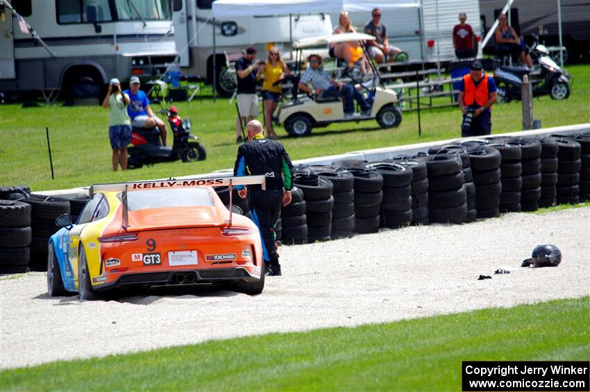 Tom Balames' Porsche GT3 Cup is stuck in the gravel trap at turn 14 on the final lap.
