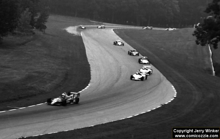 Pete Halsmer leads Al Unser, Jr., Bob Earl, Arie Luyendyk, Chip Ganassi, Bob Schader, etc through the Hurry Downs.