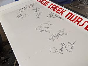 Autographs of Indy 500 drivers on the wing of a 1972 Eagle/Offenhauser.
