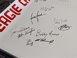 Autographs of Indy 500 drivers on the wing of a 1972 Eagle/Offenhauser.