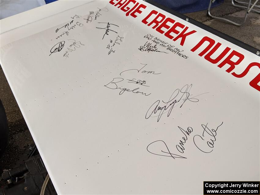Autographs of Indy 500 drivers on the wing of a 1972 Eagle/Offenhauser.