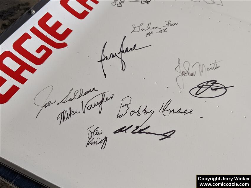 Autographs of Indy 500 drivers on the wing of a 1972 Eagle/Offenhauser.
