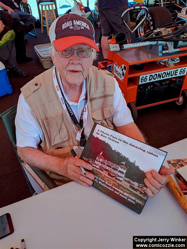 Photographer/Racing Historian Ron Nelson sells his book at the Vintage Indy display.