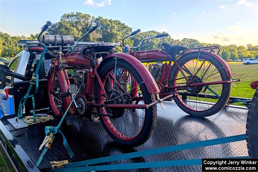 1911 Indian motorcycle on the left, and a 1912 Indian motorcycle on the right.