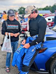 Travis Pastrana signs an autograph for a fan at parc expose at Soo Pass Ranch.