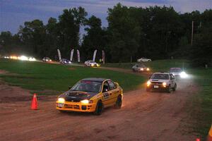 Steve Gingras / Katie Gingras Subaru Impreza and Josh Nykanen / Connor Himes VW GTI exit out of SS2, Soo Pass II.