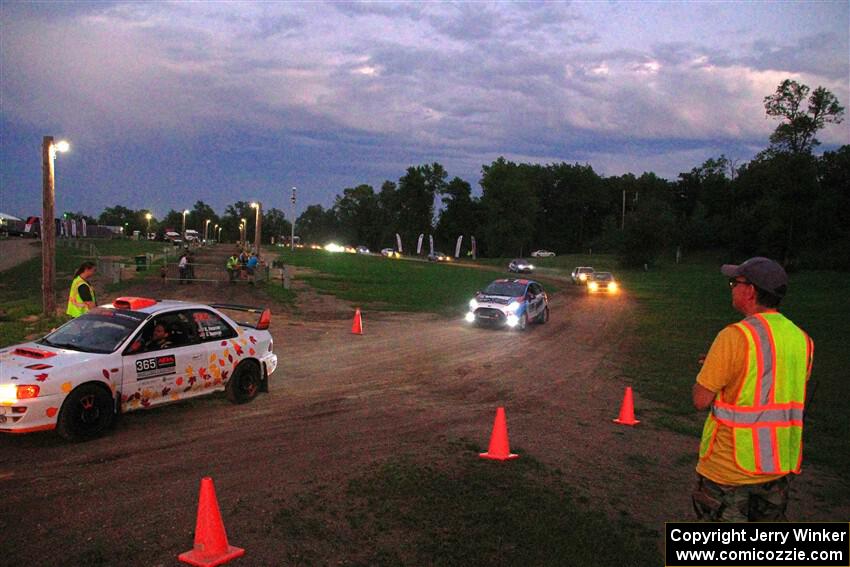 Richard Donovan / Greg Donovan Subaru Impreza and Mark Tabor / Kathryn Hansen Ford Fiesta ST exit out of SS2, Soo Pass II.