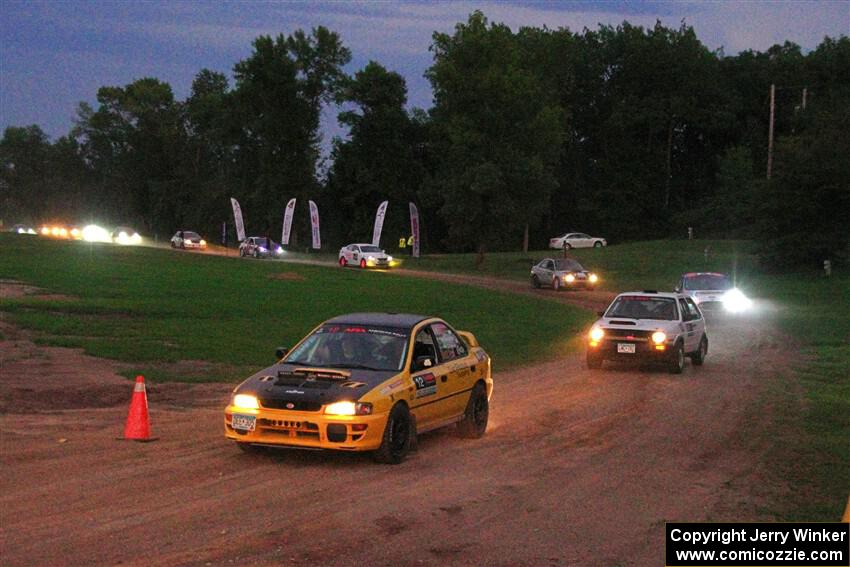 Steve Gingras / Katie Gingras Subaru Impreza and Josh Nykanen / Connor Himes VW GTI exit out of SS2, Soo Pass II.