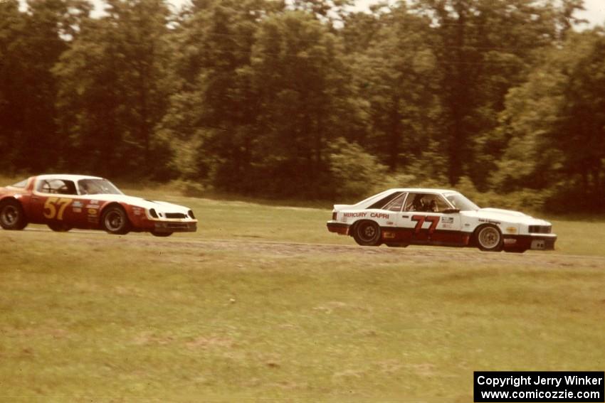 Vern Smith's Mercury Capri ahead of Patty Moise's Chevy Camaro