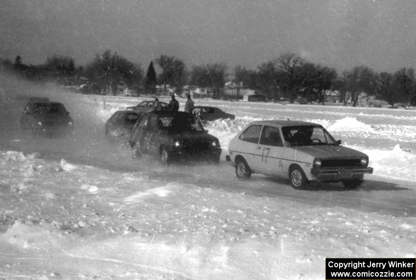 Len Jackson's Ford Fiesta and Todd Larson's Renault LeCar lead a small pack near the start of the race.