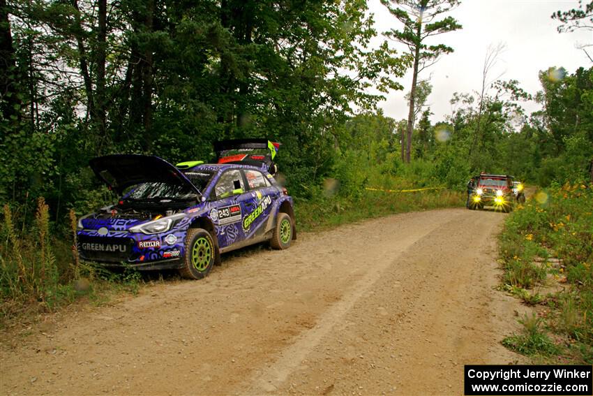 Sweep arrives to pick up the Patrick Gruszka / John Hall Hyundai i20 R5 from SS11, Otterkill I.