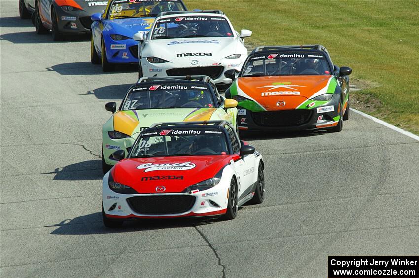 Five Mazda MX-5 Cup cars head into turn 7 during race 1.