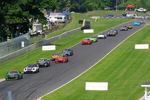 The field streams down the Hurry Downs into turn 8, on lap 1 of race 2.