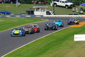 Six cars head downhill through the Hurry Downs during race 2.