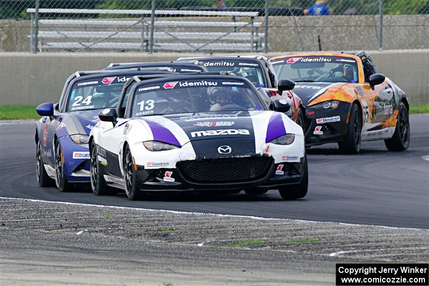 Five cars battle through turn 8.