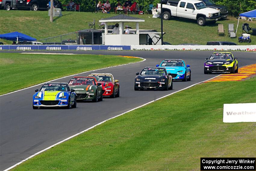 Six cars head downhill through the Hurry Downs during race 2.