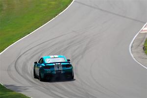 Scott Thomson's Ford Mustang Dark Horse R limps through Thunder Valley on the pace lap of race 2.