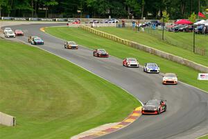 The field of Toyota GR86s streams through the Hurry Downs on lap 1 of race 1.