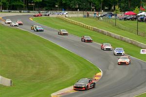 The field of Toyota GR86s streams through the Hurry Downs on lap 1 of race 1.