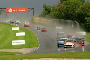 The field streams down into turn 3 on the restart.