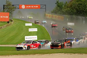 The field streams down into turn 3 on the restart.