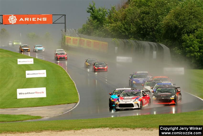 The field streams down into turn 3 on the restart.