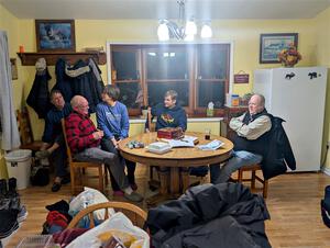 Enjoying snacks and trading rally stories at the rental house.