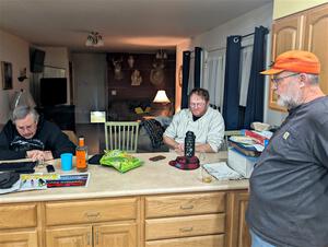 Enjoying snacks and trading rally stories at the rental house.