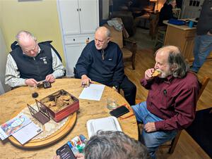 Enjoying snacks and trading rally stories at the rental house.