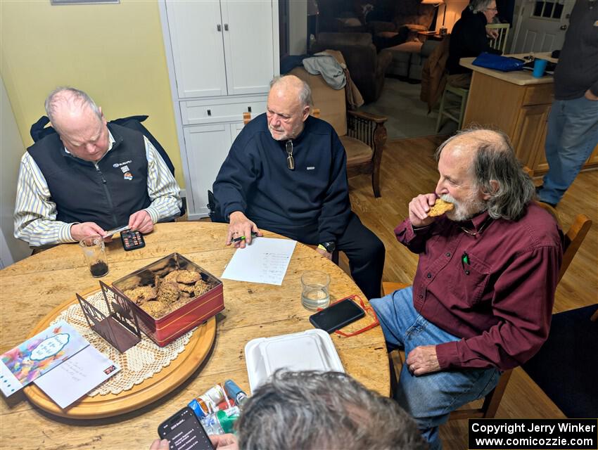 Enjoying snacks and trading rally stories at the rental house.