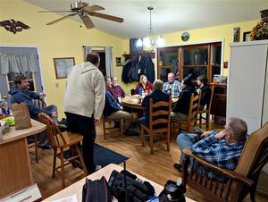 The rally crew relax at the rental house after the event.