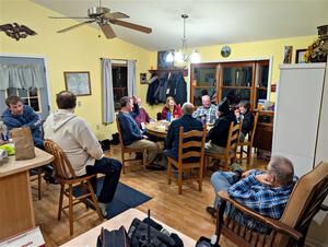 The rally crew relax at the rental house after the event.